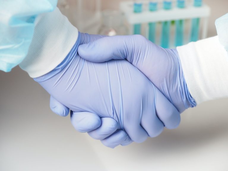 Handshake in medical gloves